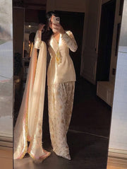 Luxury Pearl White Designer Suit Featuring Intricate Golden Embroidery Details