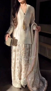 Luxury Pearl White Designer Suit Featuring Intricate Golden Embroidery Details