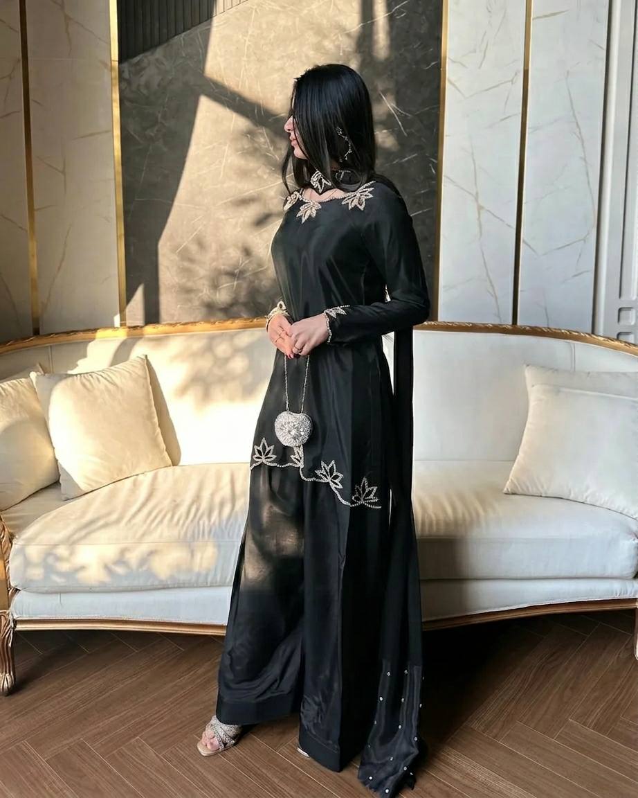 Elegant ivory salwar suit with black embroidery