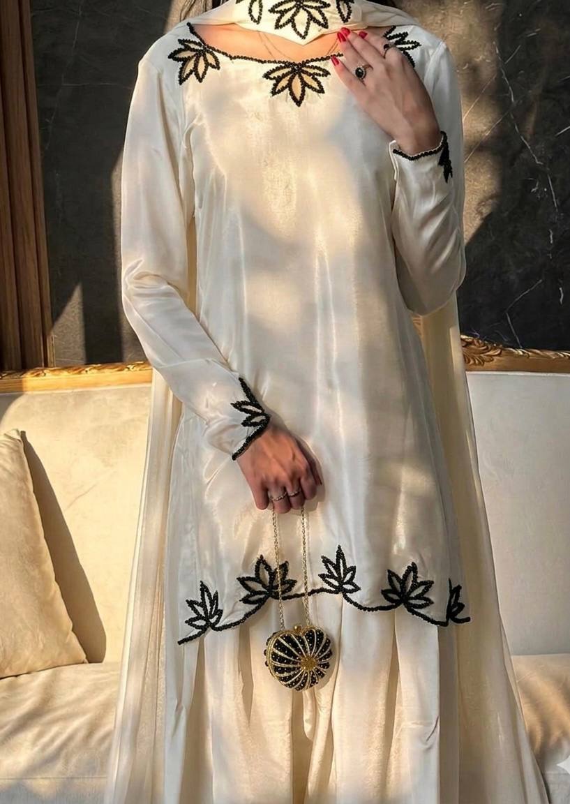 Elegant ivory salwar suit with black embroidery